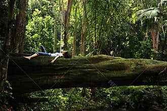 Woman relaxing in a tropical forest
