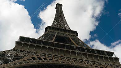 Eiffel tower blue sky with clouds down to top view hyperlapse