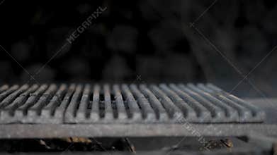 Smoldering wood in the grill