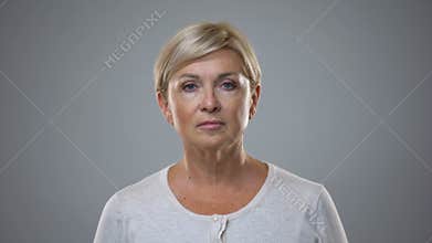 Beautiful senior lady looking in camera, anti-aging cosmetics, skin care, beauty