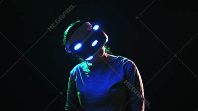 Detail woman wearing VR headset and turning head around