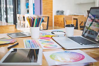 Graphic designer object tool and color swatch samples at workspace