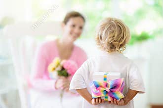 Happy mothers day. Child with present for mom