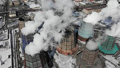 Contamination, pollution, global warming concept. Smoke and steam from industrial power plant.