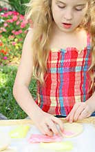 Child decorating cookie