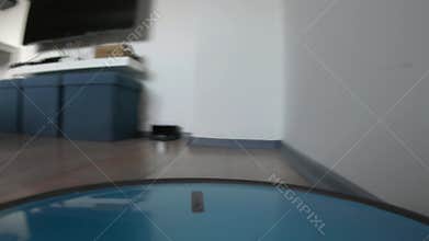 Low angle time lapse of a robot vacuum cleaner
