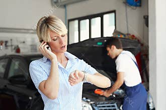 Woman in auto repair shop