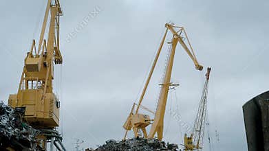 View of cranes on scrap yard.
