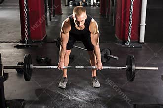 Young Man Lifting Barbell