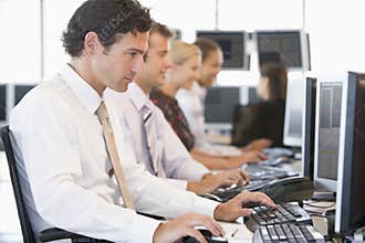 Stock Traders Working At Computers