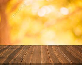 Empty wood table top on blurred abstract autumn background