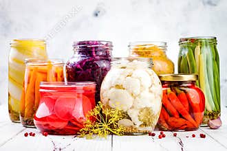Sauerkraut and marinated pickles variety preserving jars. Homemade red cabbage beetroot, turmeric kraut,