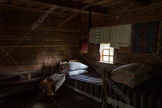 Authentic bedroom with cradle interior wooden house Lithuania
