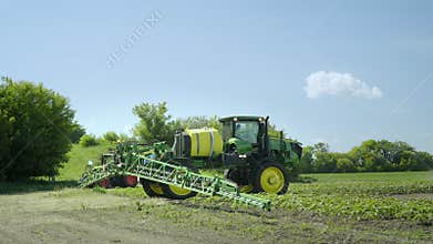 Spraying machine preparing to irrigation on farming field. Farming machinery