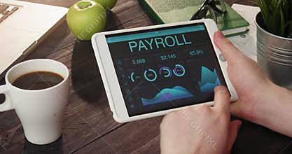 Looking at payroll records using digital tablet
