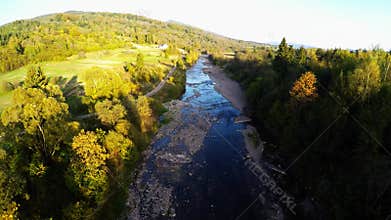 Aerial over the river in forest