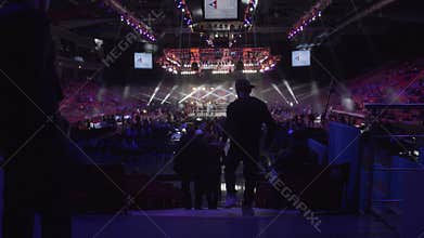 RUSSIA, MOSCOW - JUNE 9: People stand near boxing ring before fight at Fight Nights. A crowd of people at boxing ring