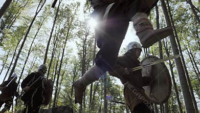 Vikings running in the forest to fight in a battle