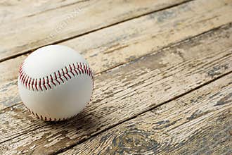 Baseball ball on old rustic wooden backstage