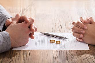 Couple`s Hand On Divorce Agreement