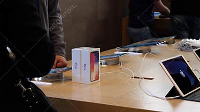 Seller scanning the iPhone X before sale
