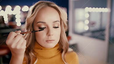 Backstage of working make up artist.