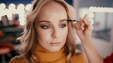 Backstage of working make up artist.