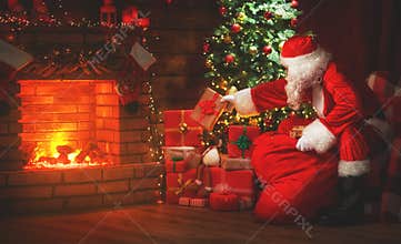 Merry Christmas! santa claus near the fireplace and tree with gi