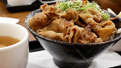 Pan shot of BU-DA DON on table