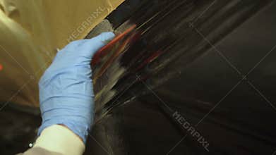Applying the auto primer on the car body 4K