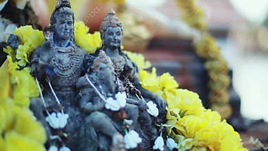 Lord Ganesha and Hinduism. Deity Ganesha with flowers, Ganesha as a symbol of Hinduism, the God of wisdom and prosperity