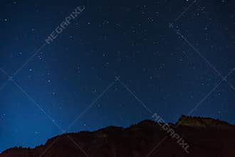 Many starts on blue dark night sky as a cosmos background.