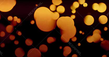 Vintage abstract circular yellow gradient glitter bokeh flowing on black background, congratulation greeting party happy