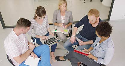 People discussing charts in office