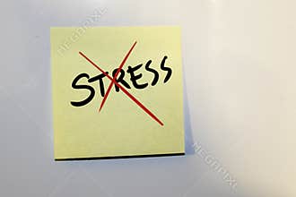 Post-it note with the text stress covered by a cross.