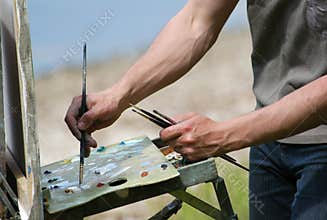 Artist's Hands with Brushes