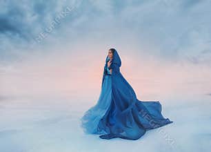 The Snow Queen in a blue raincoat that flutters in the wind. A traveler on a background of sunrise or sunset, and a