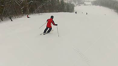 Man enjoying ski ride at mountain resort, active lifestyle, winter recreation