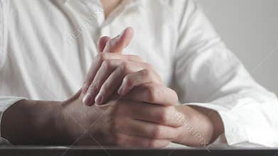 Close up of male hands expressing fear and anxiety. Man wrings hands nervously