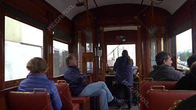 Porto, Portugal, circa 2018: Interior of an old tram, passing through the streets of Porto, Portugal.
