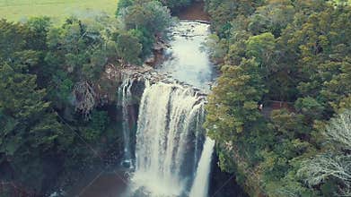 Aerial, waterfall at sunset, slow fly over 4k