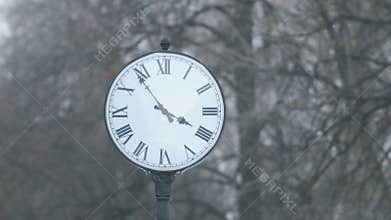Street clock dial with Roman numerals