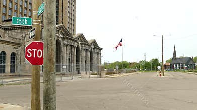 A shot from the front of Michigan Central Station, with an american flag flying