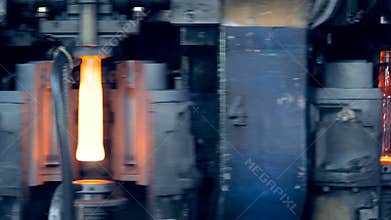 Industrial furnace is making and releasing glassy bottles