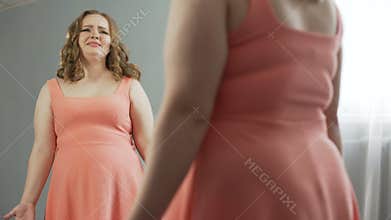 Curved lady crying and blaming herself for eating too much and becoming fat