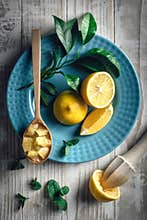 Lemon pieces on blue plate closeup
