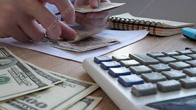 Man in the office counting money.