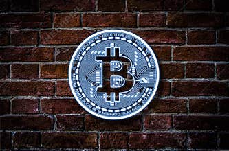 Bitcoin illustration against the brick wall
