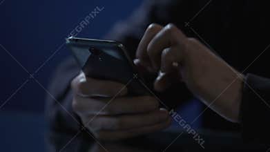 Hands of lonely man scrolling pictures on smartphone, using mobile dating app