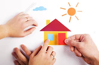 Hand with paper house